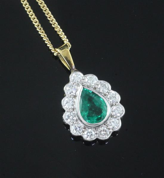 An 18ct white and yellow gold, emerald and diamond tear drop pendant, claw and millegrain-set, on 18ct yellow gold fine-link chain,